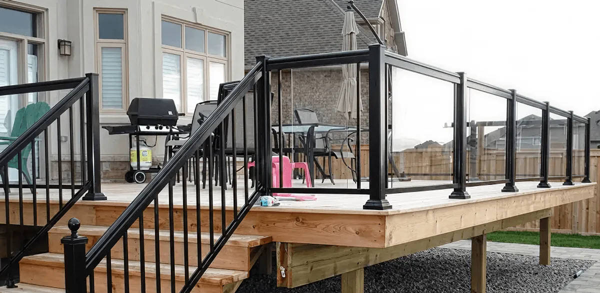 Handrail installation on a deck staircase for safety and code compliance in Milwaukee, WI